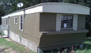 singlewide - aluminum siding - 1972 - trellis as siding (looks cheap)