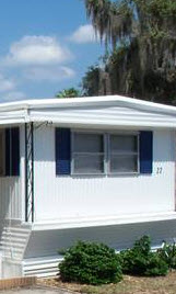 singlewide - vinyl siding on top and bottom - aluminum middle - 1967 - roof over